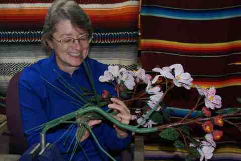 Carla working on one of the Apple Blossum branches